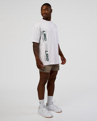 Man wearing Nothing Is Impossible FLXCotton Oversized Tee - White-Vital Green | Model:Sam | Size:L | Thumbnail Index: 10