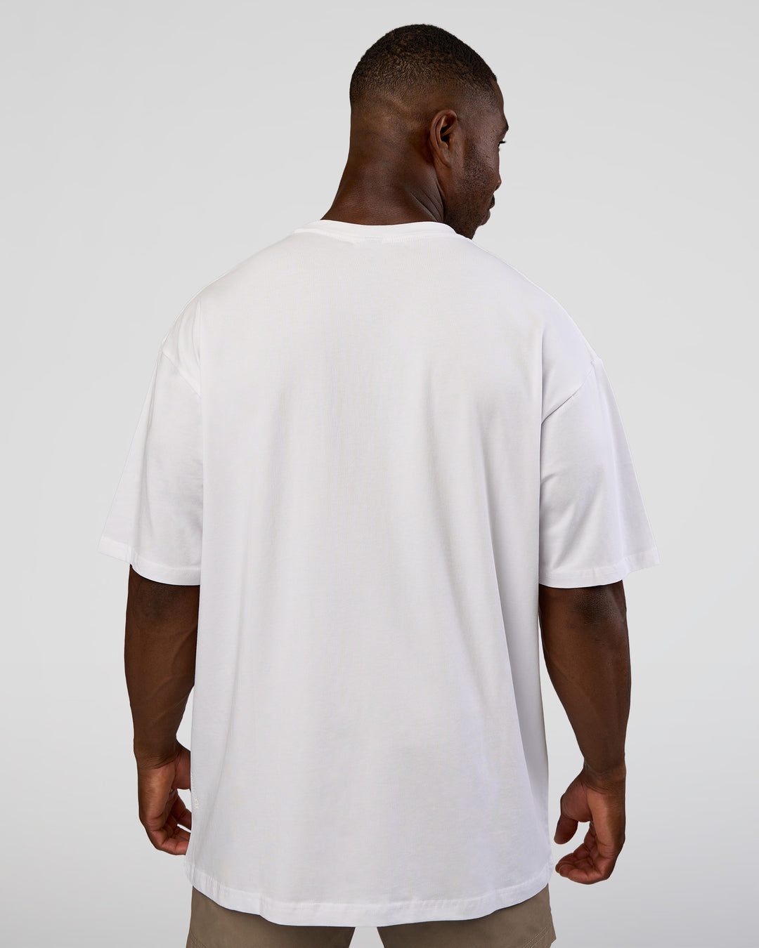 Man wearing Nothing Is Impossible FLXCotton Oversized Tee - White-Vital Green | Model:Sam | Size:L - view 6