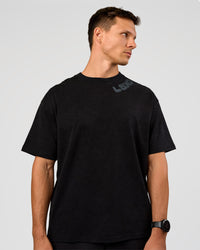 Man wearing Offset Heavyweight Unisex Oversized Tee - Black Washed-Castlerock | Model:Liam | Size:L | Thumbnail Index: 1