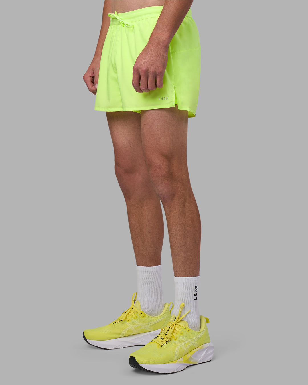 Man wearing Pace 3" Performance Short - Lime Glo | Model:Brandon | Size:L - view 14