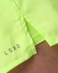 Man wearing Pace 3" Performance Short - Lime Glo | Model:Brandon | Size:L | Thumbnail Index: 7