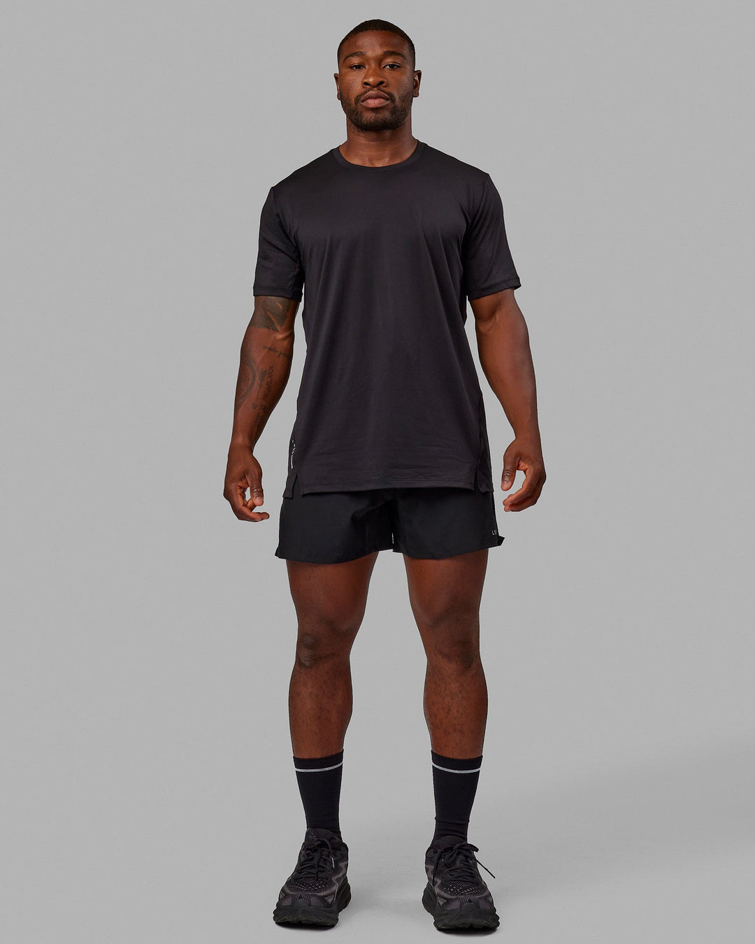 Man wearing Pace 5" Lined Performance Shorts - Black-Reflective - view 6
