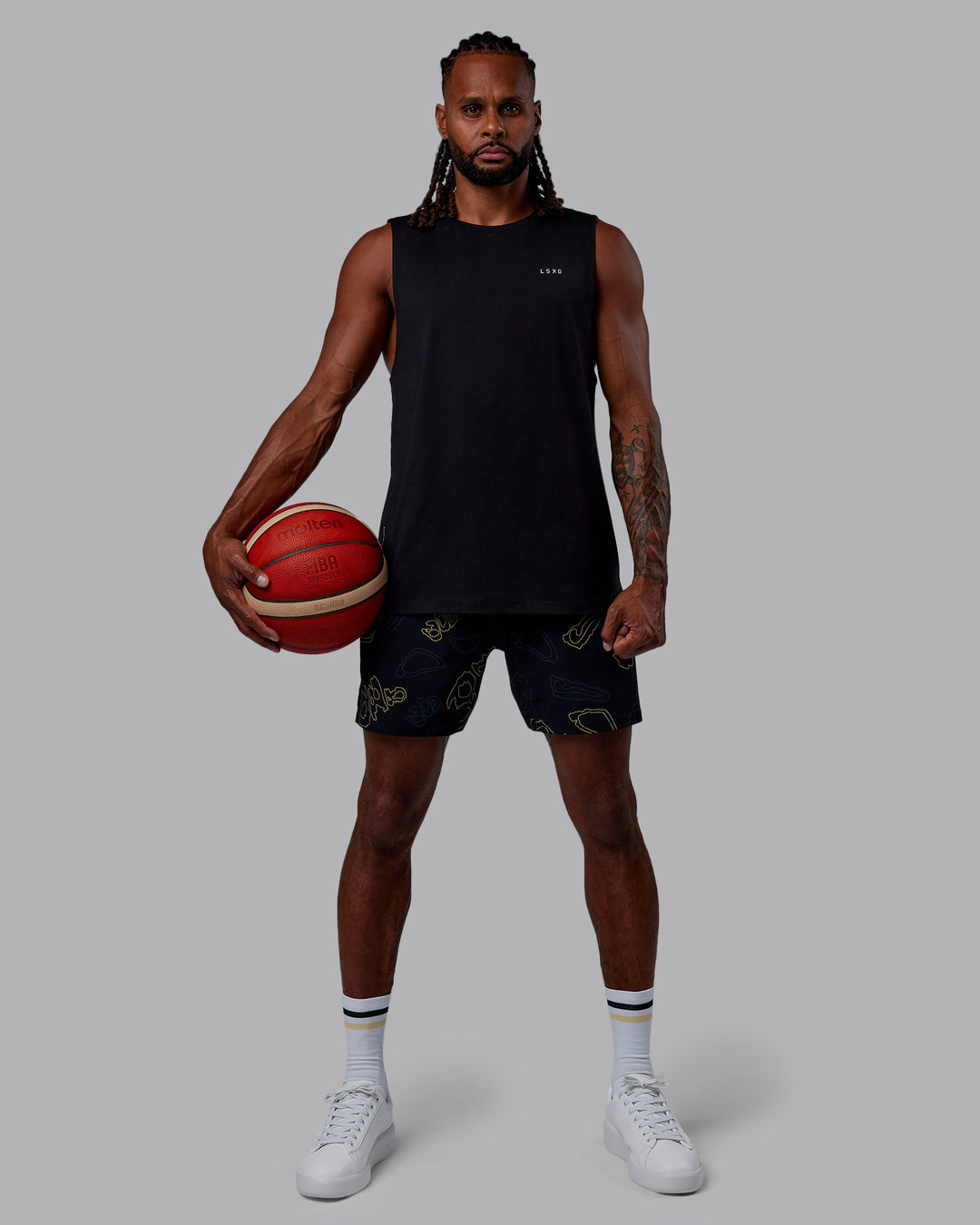 Man wearing Patty Mills Challenger 6" Performance Shorts - Black-Vital Green - view 7