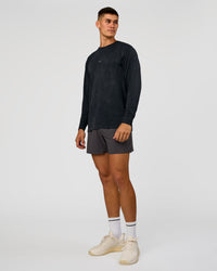 Man wearing Power Oversized Long Sleeve Tee - Black Washed | Model:Jackson | Size:L | Thumbnail Index: 1