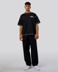 Man wearing Pressure is Privilege Oversized Tee - Black-White | Model:Jackson | Size:L | Thumbnail Index: 9