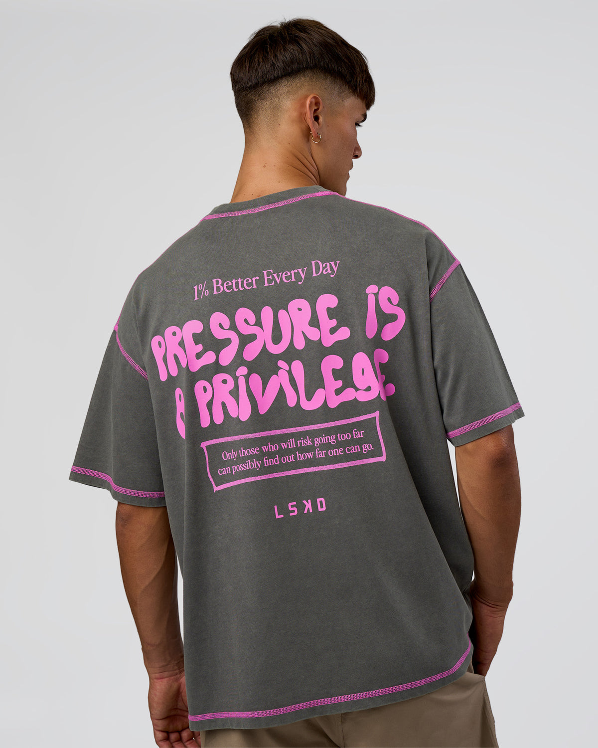 Man wearing Pressure is Privilege Oversized Tee - Dark Storm Washed-Ultra Fuchsia | Model:Jackson | Size:L