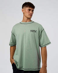 Man wearing Pressure is Privilege Oversized Tee - Iceberg Green-Black | Model:Jackson | Size:L | Thumbnail Index: 2