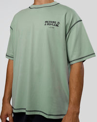Man wearing Pressure is Privilege Oversized Tee - Iceberg Green-Black | Model:Jackson | Size:L | Thumbnail Index: 8