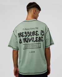 Man wearing Pressure is Privilege Oversized Tee - Iceberg Green-Black | Model:Jackson | Size:L | Thumbnail Index: 1