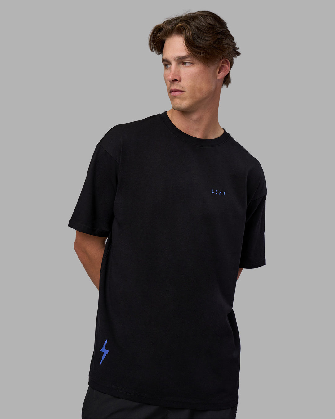 Man wearing Pressure is a Privilege FLXCotton Oversized Tee - Black-Power Cobalt | Model:Brandon | Size:L - view 12