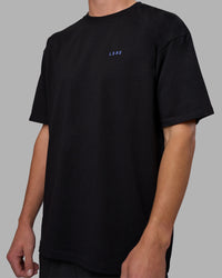 Man wearing Pressure is a Privilege FLXCotton Oversized Tee - Black-Power Cobalt | Model:Brandon | Size:L | Thumbnail Index: 12