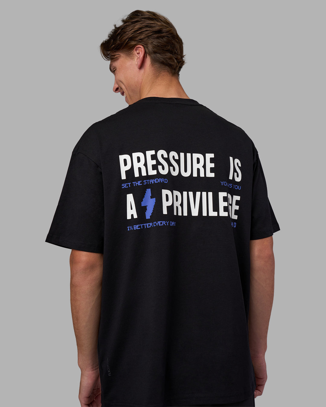 Man wearing Pressure is a Privilege FLXCotton Oversized Tee - Black-Power Cobalt | Model:Brandon | Size:L - view 7