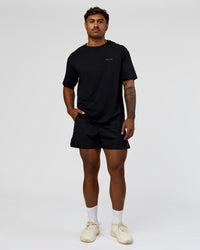Man wearing RUN CLUB FLXCotton Tee Oversize - Black-Scarlet | Model:Xav | Size:L  | Thumbnail Index: 5