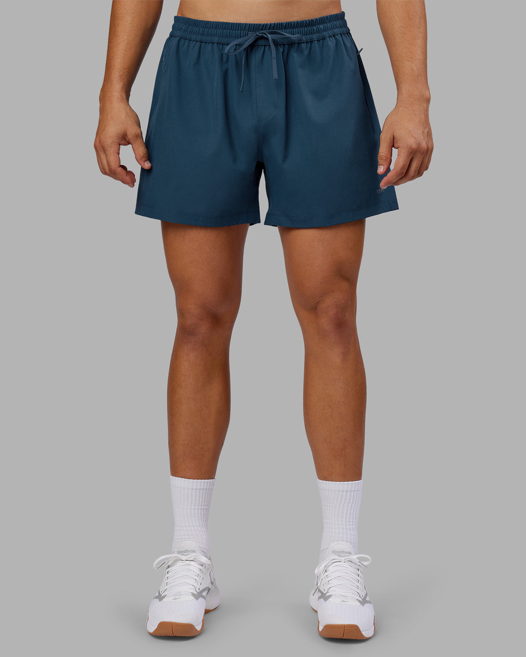 Man wearing Rep 5" Performance Short - Indigo | Model:Jackson | Size:L - view 3