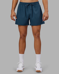 Man wearing Rep 5" Performance Short - Indigo | Model:Jackson | Size:L | Thumbnail Index: 2