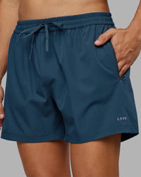Man wearing Rep 5" Performance Short - Indigo | Model:Jackson | Size:L | Thumbnail Index: 0