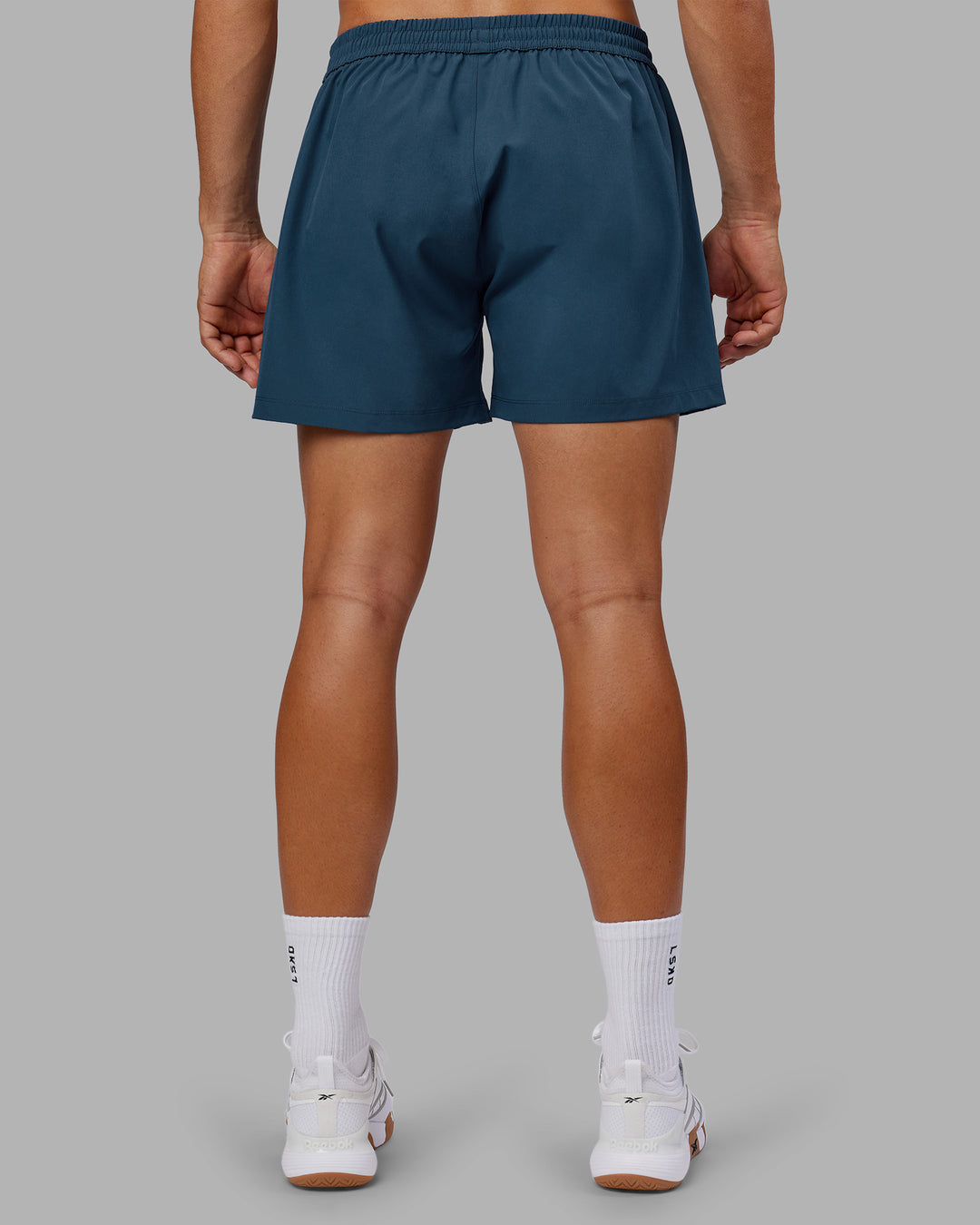 Man wearing Rep 5" Performance Short - Indigo | Model:Jackson | Size:L - view 4