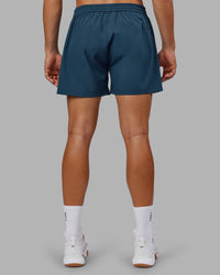 Man wearing Rep 5" Performance Short - Indigo | Model:Jackson | Size:L | Thumbnail Index: 3