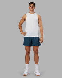 Man wearing Rep 5" Performance Short - Indigo | Model:Jackson | Size:L | Thumbnail Index: 4