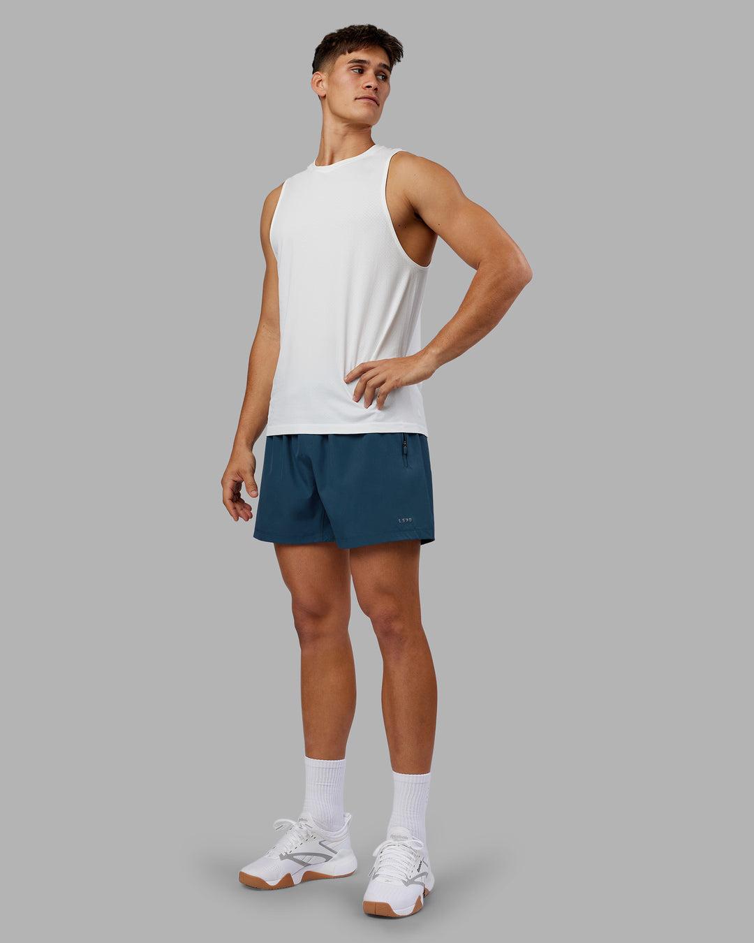 Man wearing Rep 5" Performance Short - Indigo | Model:Jackson | Size:L - view 2