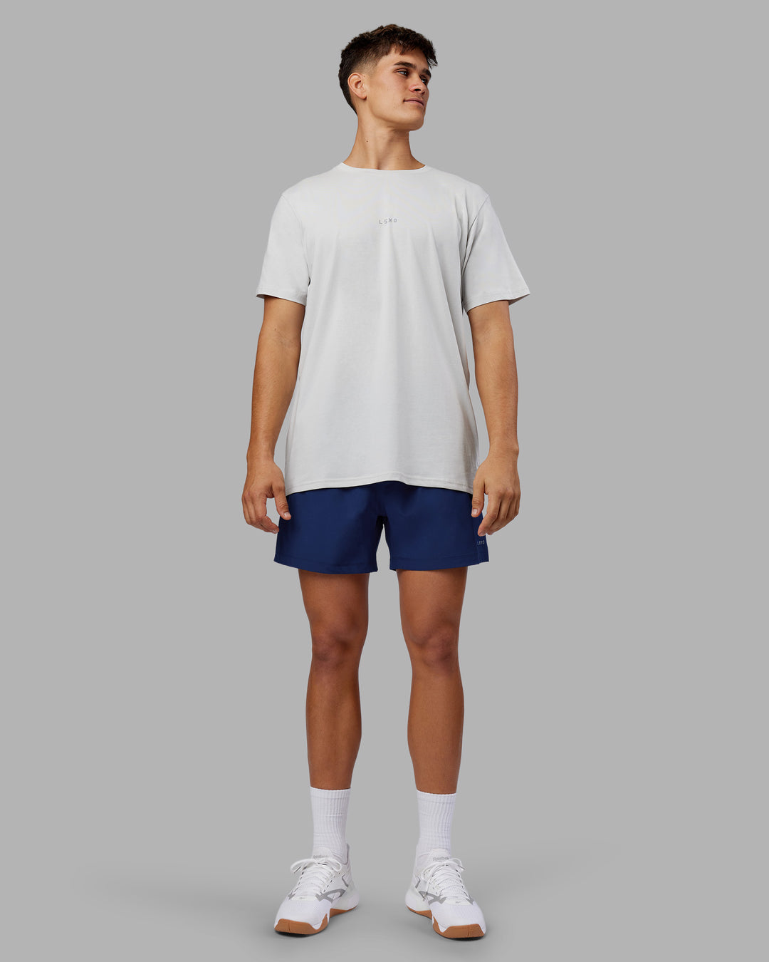 Man wearing Rep 5" Performance Short - Midnight Blue | Model:Jackson | Size:L - view 5