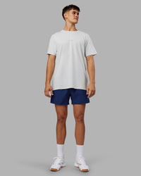 Man wearing Rep 5" Performance Short - Midnight Blue | Model:Jackson | Size:L | Thumbnail Index: 4