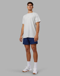 Man wearing Rep 5" Performance Short - Midnight Blue | Model:Jackson | Size:L | Thumbnail Index: 2