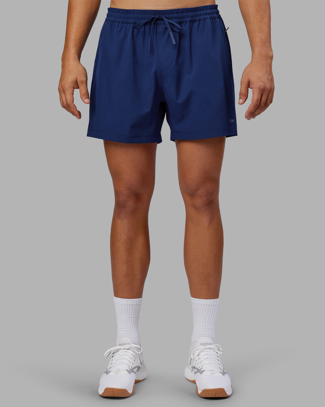 Man wearing Rep 5" Performance Short - Midnight Blue | Model:Jackson | Size:L - view 1