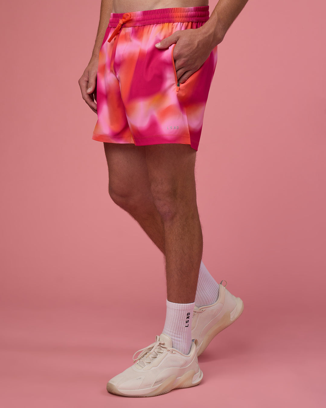 Man wearing Rep 5" Performance Short - Pink Glow Print | Model:Brandon | Size:L - view 1
