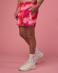 Man wearing Rep 5" Performance Short - Pink Glow Print | Model:Brandon | Size:L | Thumbnail Index: 0