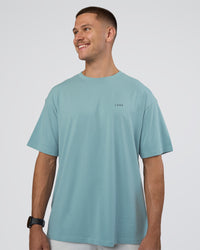 Man wearing Research Department FLXCotton Oversized Tee - Smoke Blue | Model:Nikola | Size:L | Thumbnail Index: 1
