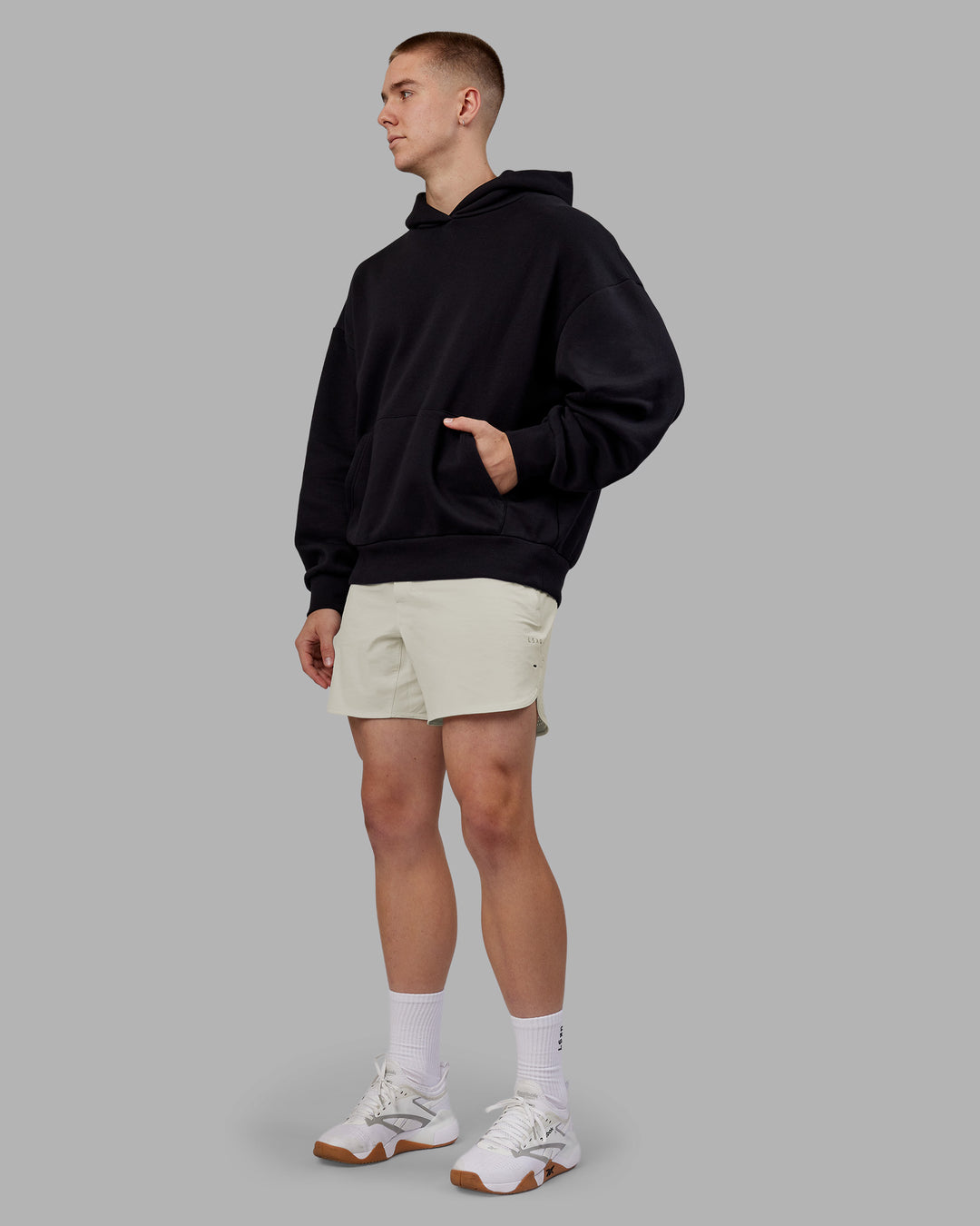 Man wearing Rise &amp; Lift Hoodie Oversized - Black-White | Model:Tom | Size:L - view 5