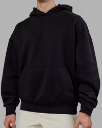 Man wearing Rise & Lift Hoodie Oversized - Black-White | Model:Tom | Size:L | Thumbnail Index: 6