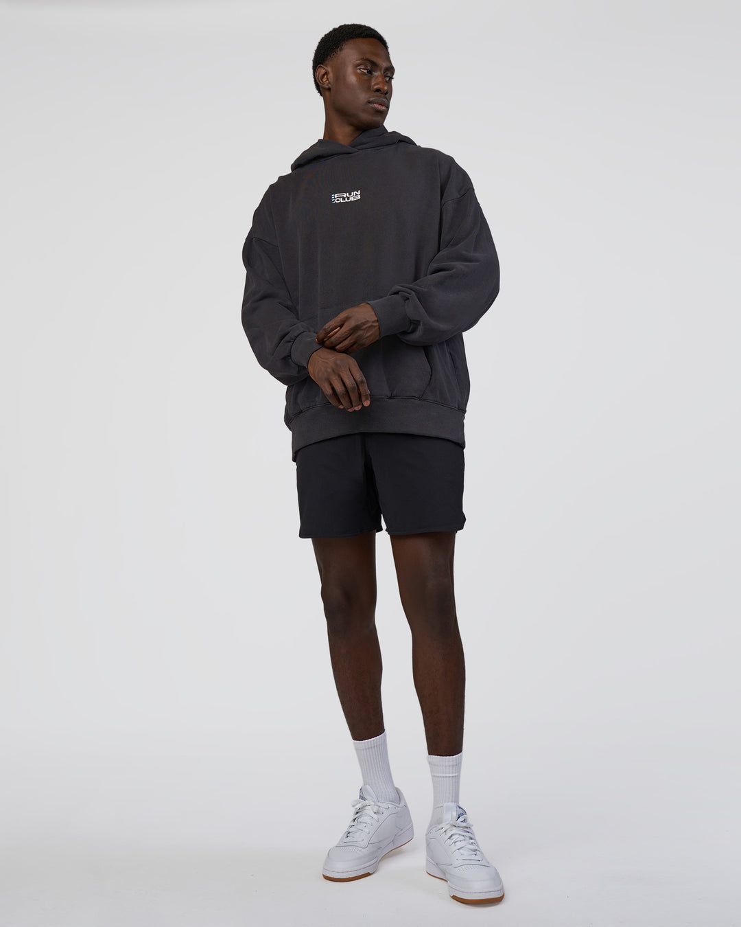 Man wearing Runner’s Unisex Oversized Hoodie - Black Washed-White | Model:Paabio | Size:L - view 6