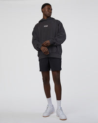 Man wearing Runner’s Unisex Oversized Hoodie - Black Washed-White | Model:Paabio | Size:L | Thumbnail Index: 5