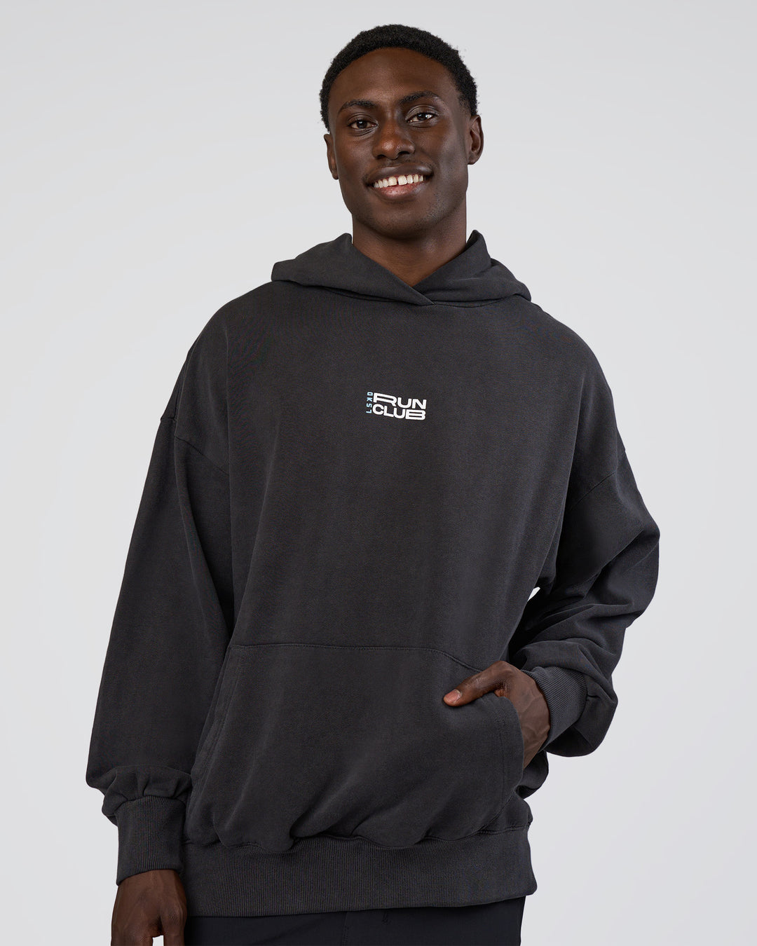 Man wearing Runner’s Unisex Oversized Hoodie - Black Washed-White | Model:Paabio | Size:L - view 9