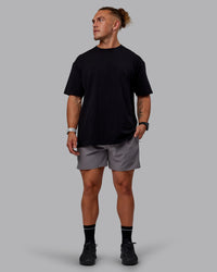Man wearing Sara GET ÆTLA SKAL Unisex FLXCotton Tee Oversize - Black-White | Thumbnail Index: 10