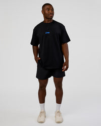 Man wearing Standard Issue FLXCotton Oversized Tee - Black-Palace Blue | Model:Sam | Size:L | Thumbnail Index: 7