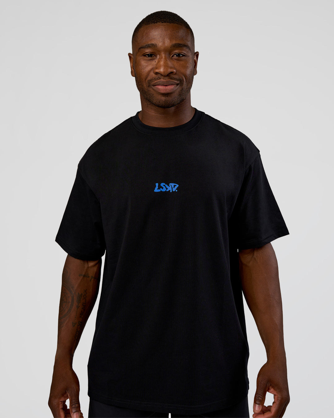 Man wearing Standard Issue FLXCotton Oversized Tee - Black-Palace Blue | Model:Sam | Size:L - view 3