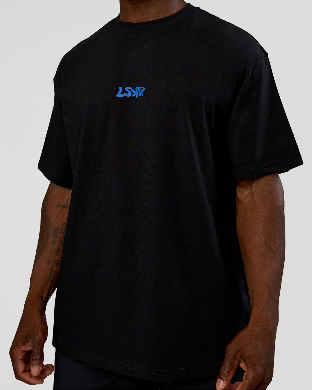 Man wearing Standard Issue FLXCotton Oversized Tee - Black-Palace Blue | Model:Sam | Size:L - view 9