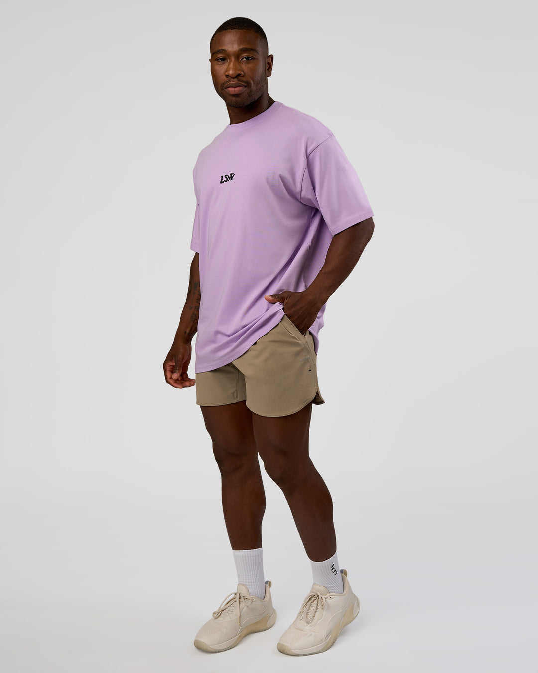 Man wearing Standard Issue FLXCotton Oversized Tee - Pale Lilac-Black | Model:Sam | Size:L - view 3