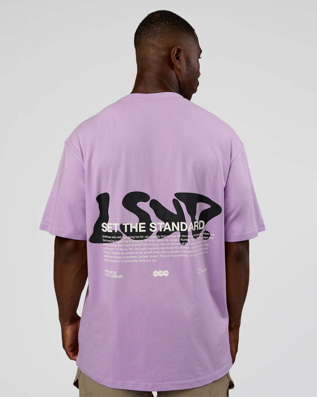 Man wearing Standard Issue FLXCotton Oversized Tee - Pale Lilac-Black | Model:Sam | Size:L - view 2