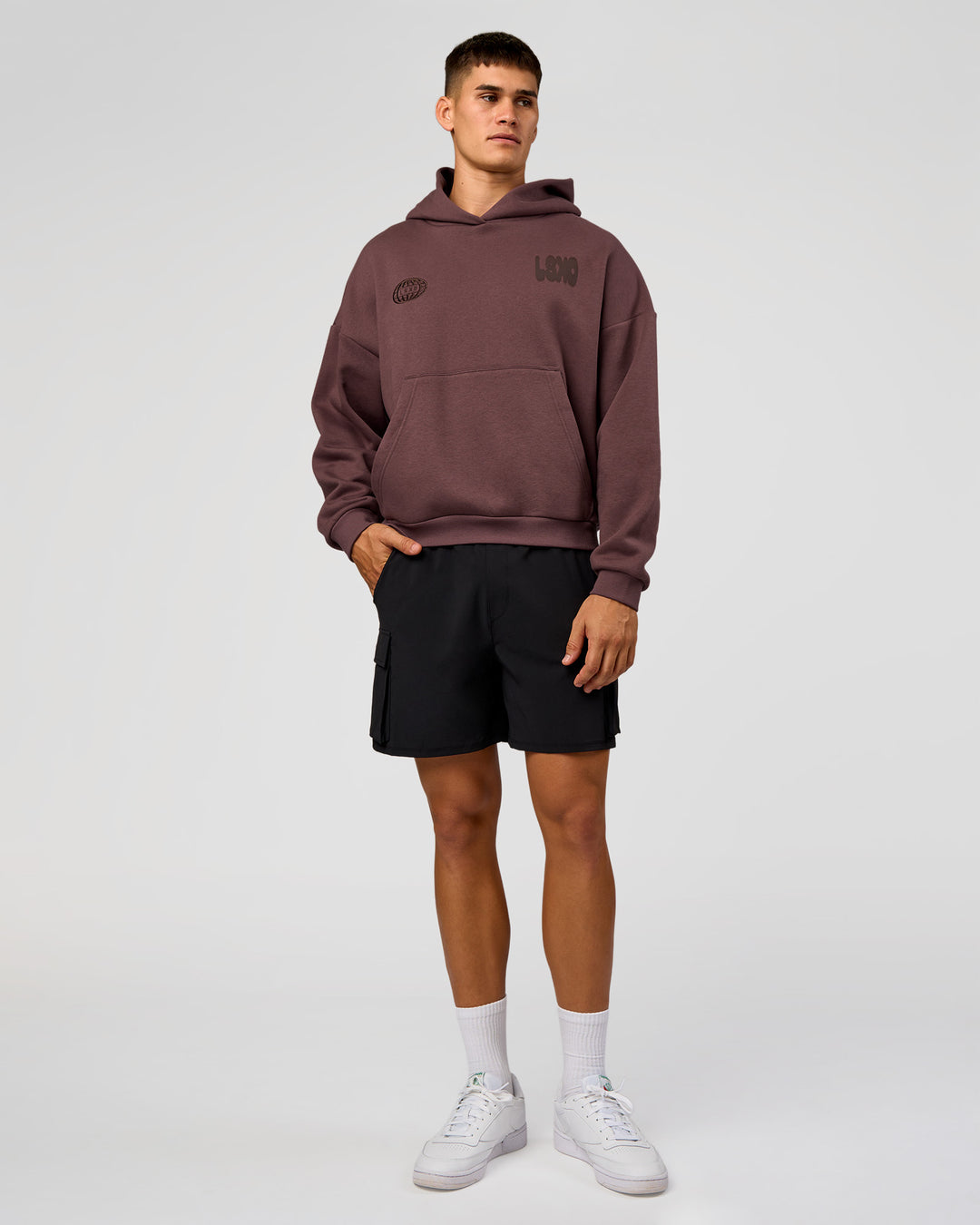 Man wearing Static Grit Unisex Boxy Hoodie - Cocoa Powder-Hot Chocolate | Model:Jackson | Size:L - view 6