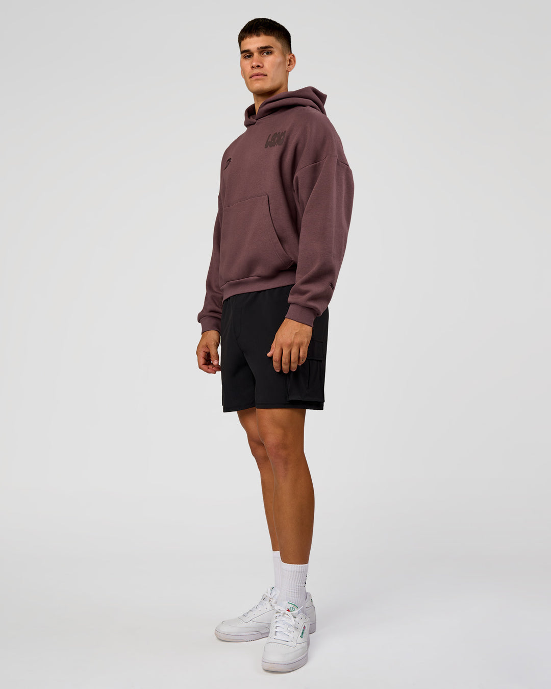 Man wearing Static Grit Unisex Boxy Hoodie - Cocoa Powder-Hot Chocolate | Model:Jackson | Size:L - view 12