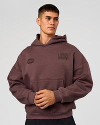 Man wearing Static Grit Unisex Boxy Hoodie - Cocoa Powder-Hot Chocolate | Model:Jackson | Size:L | Thumbnail Index: 1