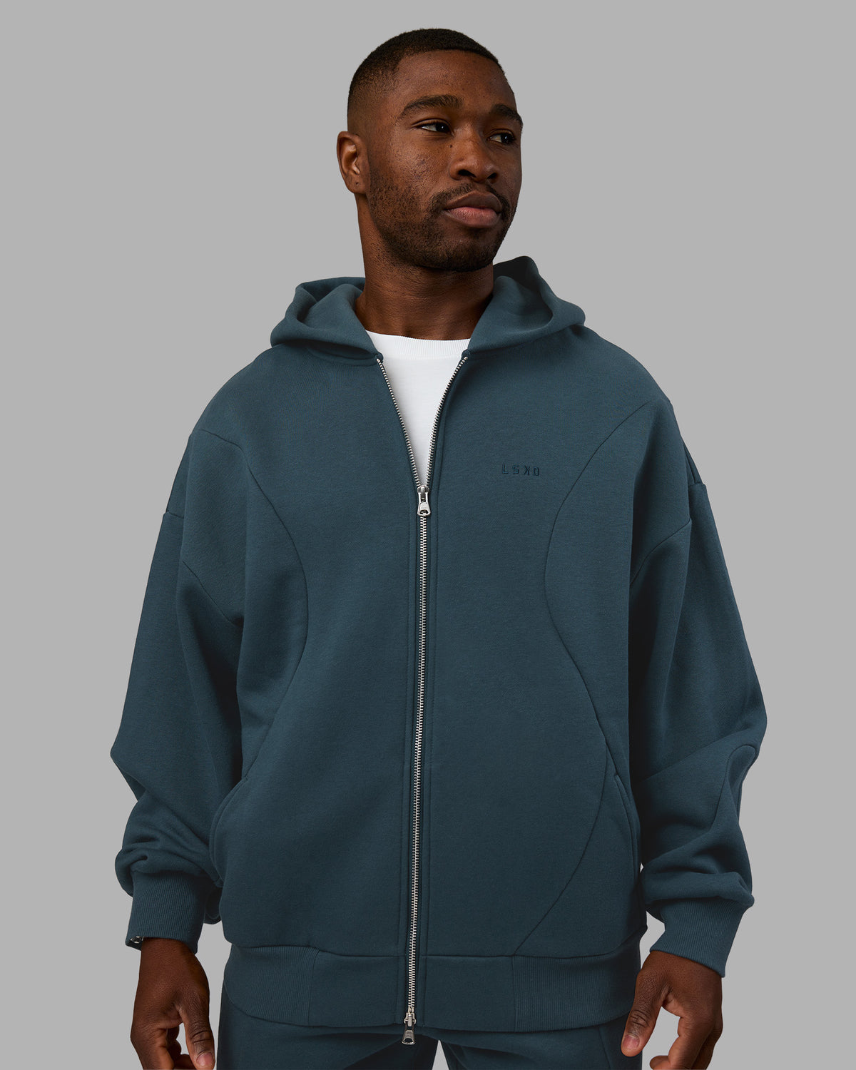 Man wearing Stream Oversized Panel Zip Hoodie - Deep Sea | Model:Sam | Size:L