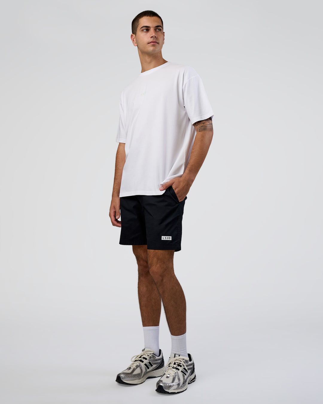 Man wearing Together We Rise FLXCotton Oversized Tee - White-Solar Lime | Model:Zoran | Size:L - view 5