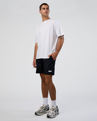 Man wearing Together We Rise FLXCotton Oversized Tee - White-Solar Lime | Model:Zoran | Size:L | Thumbnail Index: 4