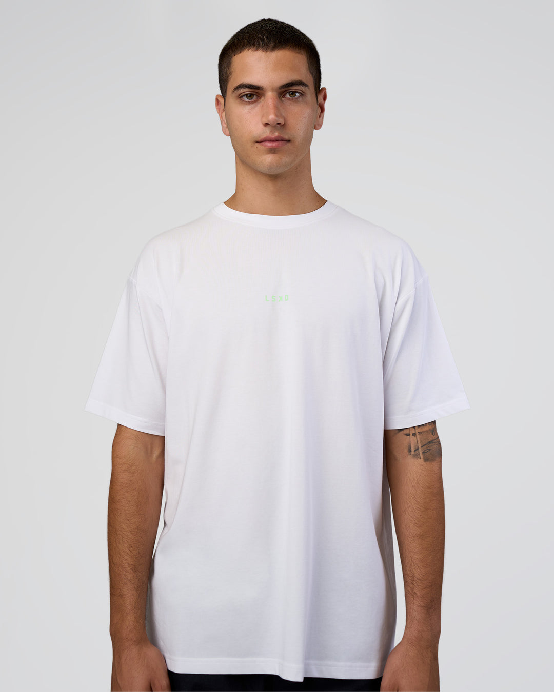 Man wearing Together We Rise FLXCotton Oversized Tee - White-Solar Lime | Model:Zoran | Size:L - view 6