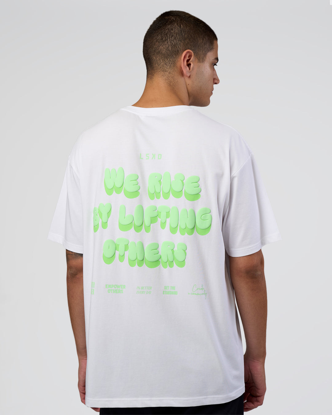 Man wearing Together We Rise FLXCotton Oversized Tee - White-Solar Lime | Model:Zoran | Size:L - view 1